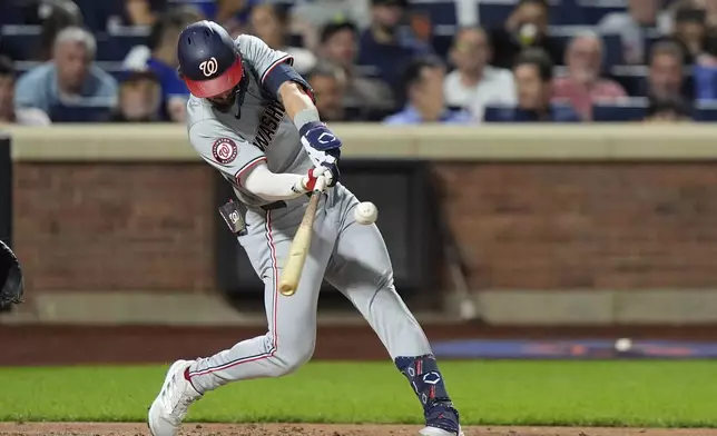 Washington Nationals' Dylan Crews hits a double during the second inning of a baseball game against the New York Mets, Tuesday, Sept. 17, 2024, in New York. (AP Photo/Frank Franklin II)