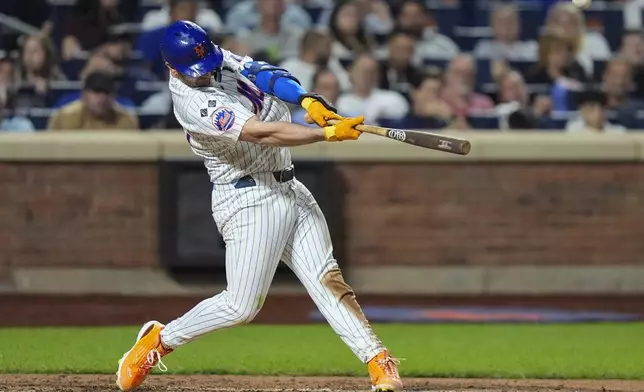 New York Mets' Pete Alonso hits a three-run home run during the sixth inning of a baseball game against the Washington Nationals, Tuesday, Sept. 17, 2024, in New York. (AP Photo/Frank Franklin II)