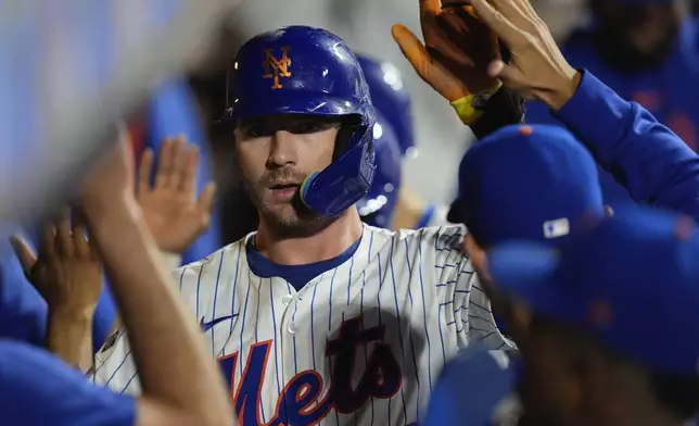 New York Mets' Pete Alonso celebrates with teammates after hitting a three-run home run during the sixth inning of a baseball game against the Washington Nationals, Tuesday, Sept. 17, 2024, in New York. (AP Photo/Frank Franklin II)