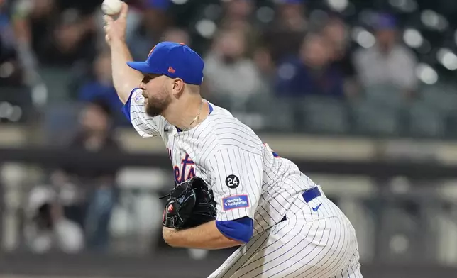 New York Mets' Tylor Megill pitches during the first inning of a baseball game against the Washington Nationals, Tuesday, Sept. 17, 2024, in New York. (AP Photo/Frank Franklin II)