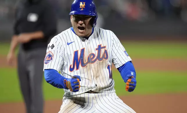 New York Mets' Jose Iglesias celebrates after hitting an RBI single during the eighth inning of a baseball game against the Washington Nationals, Monday, Sept. 16, 2024, in New York. (AP Photo/Frank Franklin II)