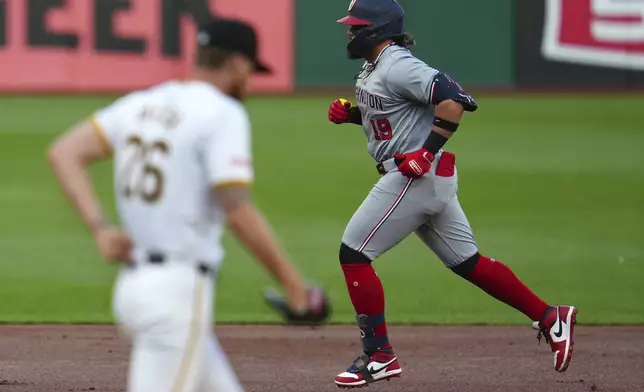 Washington Nationals' Andrés Chaparro (19) rounds the bases after hitting a two-run home run off Pittsburgh Pirates starting pitcher Bailey Falter, left, during the first inning of a baseball game in Pittsburgh, Thursday, Sept. 5, 2024. (AP Photo/Gene J. Puskar)