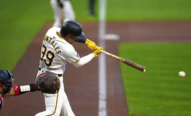 Pittsburgh Pirates' Nick Gonzales singles off Washington Nationals starting pitcher Jake Irvin, driving in two runs, during the second inning of a baseball game in Pittsburgh, Thursday, Sept. 5, 2024. (AP Photo/Gene J. Puskar)