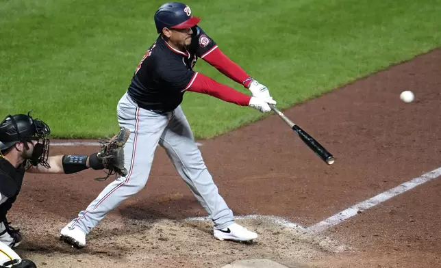 Washington Nationals' Ildemaro Vargas doubles to right field off Pittsburgh Pirates relief pitcher Aroldis Chapman, driving in two runs, during the ninth inning of the second baseball game of a doubleheader in Pittsburgh, Saturday, Sept. 7, 2024. (AP Photo/Gene J. Puskar)