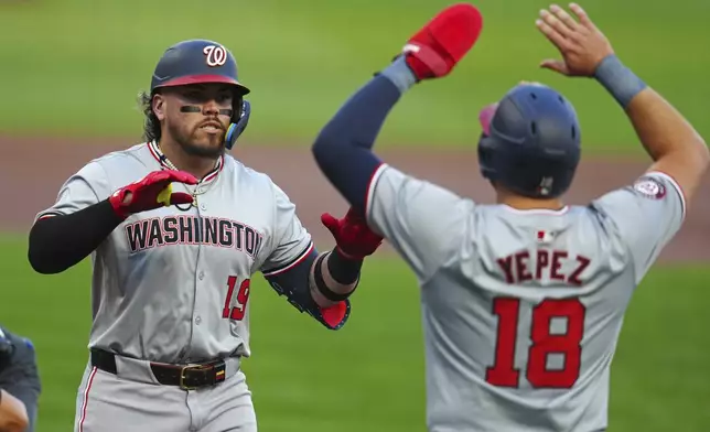 Washington Nationals' Andrés Chaparro (19) is greeted by Juan Yepez as he crosses home plate after hitting a two-run home run off Pittsburgh Pirates starting pitcher Bailey Falter during the first inning of a baseball game in Pittsburgh, Thursday, Sept. 5, 2024. (AP Photo/Gene J. Puskar)