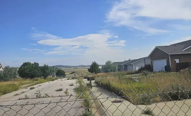 This photo taken April 27, 2022, by Tonya Junker shows a sinkhole in the Hideaway Hills neighborhood near Rapid City, S.D. (Tonya Junker via AP)