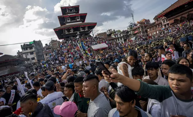 Devotees gather to watch the annual Indra Jatra festival that marks the end of the rainy season in Kathmandu, Nepal, Tuesday, Sept. 17, 2024. (AP Photo/Niranjan Shrestha)