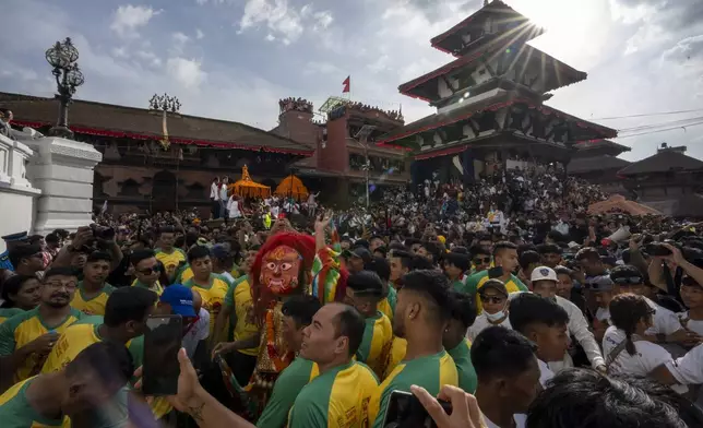 The Lakhe, a demon adored for divine might, performs during Indra Jatra, a festival that marks the end of the rainy season in Kathmandu, Nepal, Tuesday, Sept. 17, 2024. (AP Photo/Niranjan Shrestha)