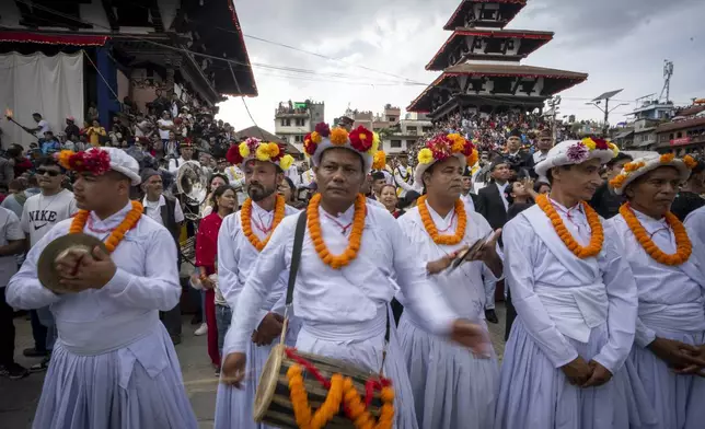 Devotees play traditional drums during Indra Jatra, a festival that marks the end of the rainy season in Kathmandu, Nepal, Tuesday, Sept. 17, 2024. (AP Photo/Niranjan Shrestha)