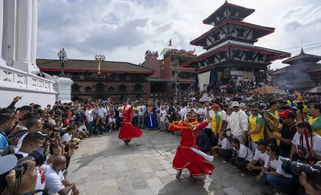 Masked dancers perform during Indra Jatra, a festival that marks the end of the rainy season in Kathmandu, Nepal, Tuesday, Sept. 17, 2024. (AP Photo/Niranjan Shrestha)