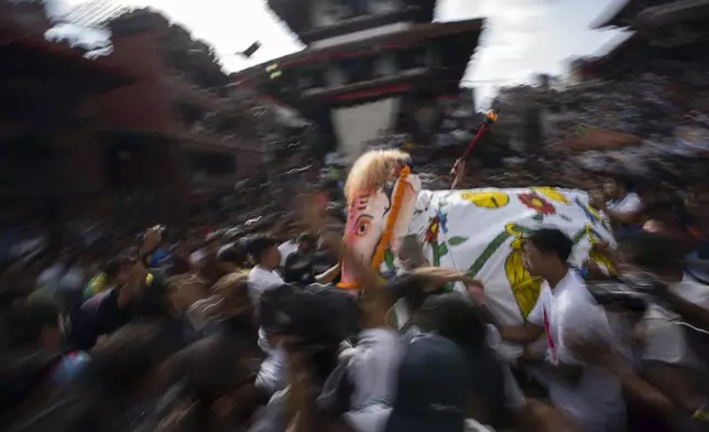 Devotees perform a traditional elephant dance during Indra Jatra, a festival that marks the end of the rainy season in Kathmandu, Nepal, Tuesday, Sept. 17, 2024. (AP Photo/Niranjan Shrestha)