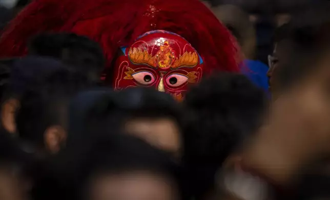 The Lakhe, a demon adored for divine might, performs during Indra Jatra, a festival that marks the end of the rainy season in Kathmandu, Nepal, Tuesday, Sept. 17, 2024. (AP Photo/Niranjan Shrestha)