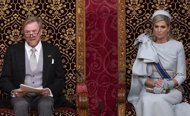 Dutch King Willem-Alexander, seated next to Queen Maxima, outlines the new government's policy plans and budget for the coming year in The Hague, Netherlands, Tuesday, Sept. 17, 2024. (AP Photo/Peter Dejong)