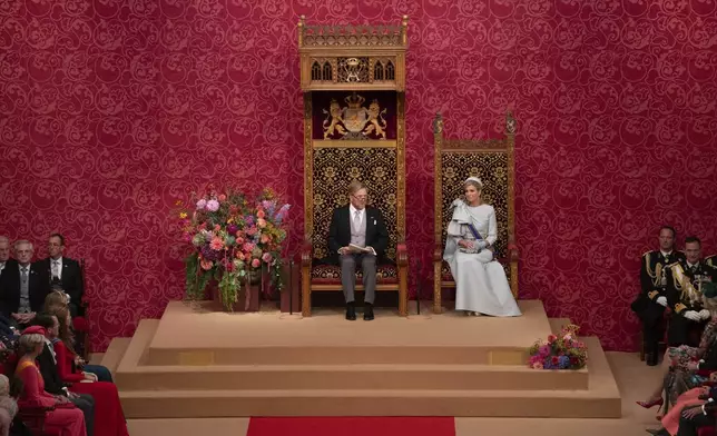 Dutch King Willem-Alexander, seated next to Queen Maxima, outlines the new government's policy plans and budget for the coming year in The Hague, Netherlands, Tuesday, Sept. 17, 2024. (AP Photo/Peter Dejong)