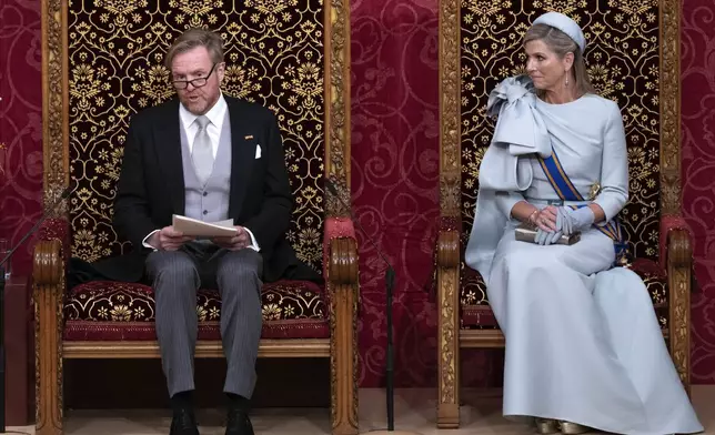 Dutch King Willem-Alexander, seated next to Queen Maxima, outlines the new government's policy plans and budget for the coming year in The Hague, Netherlands, Tuesday, Sept. 17, 2024. (AP Photo/Peter Dejong)