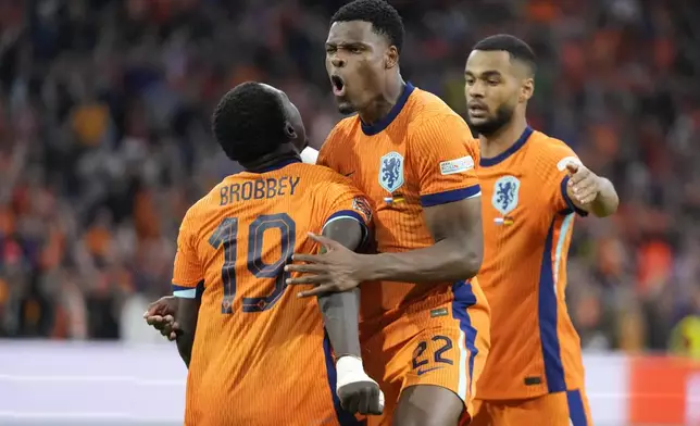 Denzel Dumfries of the Netherlands celebrates after he scored a goal during the UEFA Nations League soccer match between Netherlands and Germany in Amsterdam, Netherlands, on Tuesday, Sept. 10, 2024. (AP Photo/Peter Dejong)