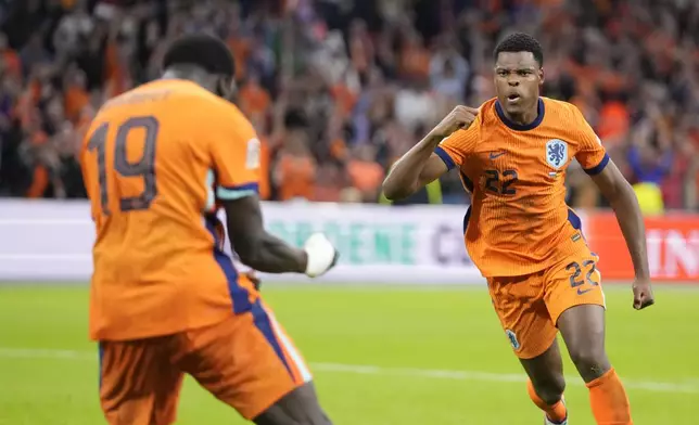 Denzel Dumfries of the Netherlands celebrates after he scored a goal during the UEFA Nations League soccer match between Netherlands and Germany in Amsterdam, Netherlands, on Tuesday, Sept. 10, 2024. (AP Photo/Peter Dejong)