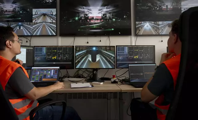 Technicians work in the control room at a testing ground for a high-speed transit system during a press tour of an European test center for hyperloop transportation technology in Veendam, northern Netherlands, Friday, Sept. 6, 2024. (AP Photo/Peter Dejong)