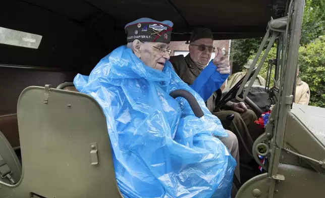 World War II veteran Kenneth Thayer flashes a thumbs up from a jeep during a ceremony marking the 80th anniversary of the liberation of the south of the Netherlands in Mesch, Thursday, Sept. 12, 2024. (AP Photo/Peter Dejong, Pool)