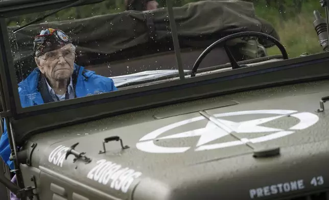 World War II veteran Kenneth Thayer sits in a jeep during a ceremony marking the 80th anniversary of the liberation of the south of the Netherlands in Mesch, Thursday, Sept. 12, 2024. (AP Photo/Peter Dejong, Pool)