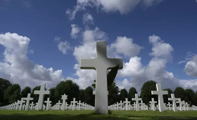 Eighty years after the liberation of the south of the Netherlands the grave of Second Lt. Royce Taylor, a bombardier with the 527 Bomb Squadron, center, stands among the 8,288 crosses and Star of David headstones at the Netherlands American Cemetery in Margraten, southern Netherlands, on Wednesday, Sept. 11, 2024. (AP Photo/Peter Dejong)