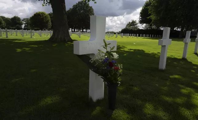 Eighty years after the liberation of the south of the Netherlands the grave of Second Lt. Royce Taylor, a bombardier with the 527 Bomb Squadron, center, stands among the 8,288 crosses and Star of David headstones at the Netherlands American Cemetery in Margraten, southern Netherlands, on Wednesday, Sept. 11, 2024. (AP Photo/Peter Dejong)