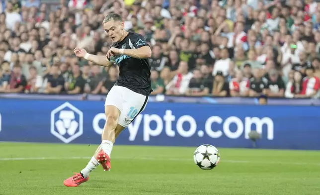 Leverkusen's Florian Wirtz scores during the Champions League opening phase soccer match between Feyenoord and Leverkusen in Rotterdam, Netherlands, Thursday, Sept. 19, 2024. (AP Photo/Peter Dejong)