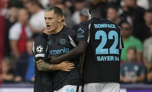 Leverkusen's Florian Wirtz reacts after he scored during the Champions League opening phase soccer match between Feyenoord and Leverkusen in Rotterdam, Netherlands, Thursday, Sept. 19, 2024. (AP Photo/Peter Dejong)