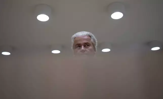 Anti-Islam lawmaker Geert Wilders takes his seat at the high security court at Schiphol, near Amsterdam, Netherlands, Monday, Sept. 9, 2024, to hear the verdict against two Pakistani men on charges of threatening Wilders. (AP Photo/Peter Dejong)