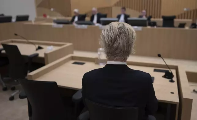 Anti-Islam lawmaker Geert Wilders, is seated at the high security court at Schiphol, near Amsterdam, Netherlands, Monday, Sept. 2, 2024, where two Pakistani men go on trial, likely in their absence, on charges of threatening anti-Islam lawmaker Wilders, whose Party for Freedom won national elections last year. (AP Photo/Peter Dejong)