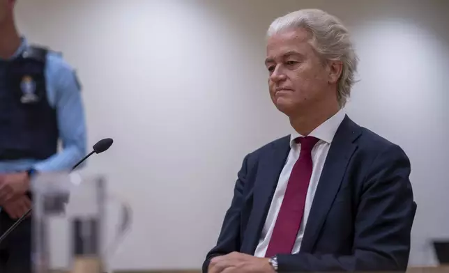 Anti-Islam lawmaker Geert Wilders, takes his seat at the high security court at Schiphol, near Amsterdam, Netherlands, Monday, Sept. 2, 2024, where two Pakistani men go on trial, likely in their absence, on charges of threatening anti-Islam lawmaker Wilders, whose Party for Freedom won national elections last year. (AP Photo/Peter Dejong)