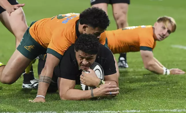 New Zealand's Caleb Clarke scores a try during their Rugby Championship match between the All Blacks and the Wallabies in Wellington, New Zealand, Saturday, Sept. 28, 2024.(Kerry Marshall/Photosport via AP)