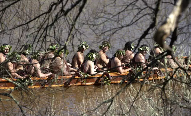 A waka, a traditional canoe, is paddled by warriors on the Waikato River as part of the funeral of New Zealand's Maori King, Kiingi Tuheitia Pootatau Te Wherowhero VII, in Ngaruawahia, New Zealand, Thursday, Sept. 5, 2024. (AP Photo/Alan Gibson)