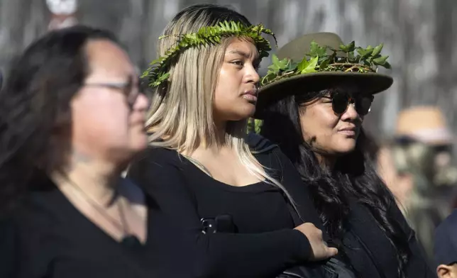 Mourners gather outside Turangawaewae Marae for the funeral of New Zealand's Māori King, Kiingi Tuheitia Pootatau Te Wherowhero VII, in Ngaruawahia, New Zealand, Thursday, Sept 5, 2024. (AP Photo/Alan Gibson)