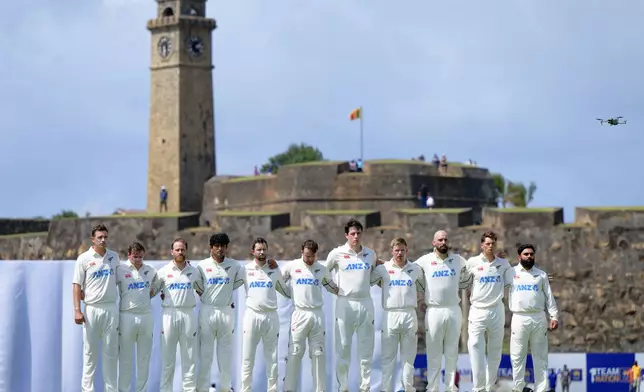 New Zealand's players stand for the national anthems before the start of the first day of the first cricket test match between New Zealand and Sri Lanka in Galle, Sri Lanka, Wednesday, Sept. 18, 2024. (AP Photo/Viraj Kothalawala)