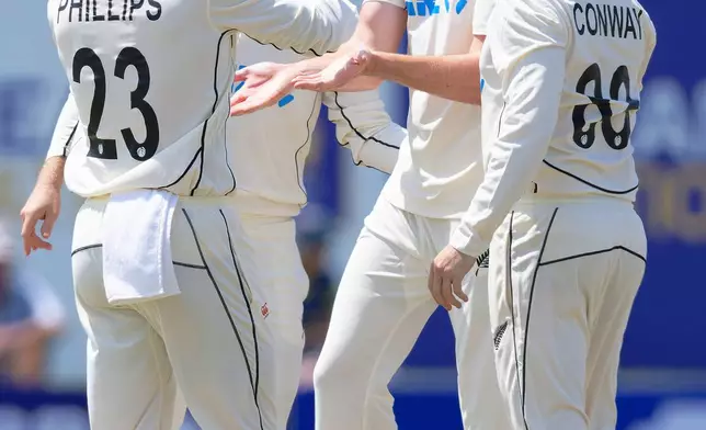 New Zealand's William O'Rourke, second right, celebrates the wicket of Sri Lanka's Pathum Nissanka on the first day of the first cricket test match between New Zealand and Sri Lanka in Galle, Sri Lanka, Wednesday, Sept. 18, 2024. (AP Photo/Viraj Kothalawala)