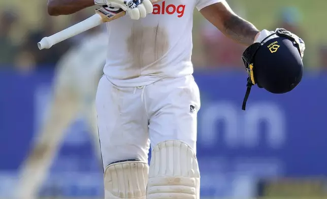 Sri Lanka's Kamindu Mendis celebrates his century on the first day of the first cricket test match between New Zealand and Sri Lanka in Galle, Sri Lanka, Wednesday, Sept. 18, 2024. (AP Photo/Viraj Kothalawala)