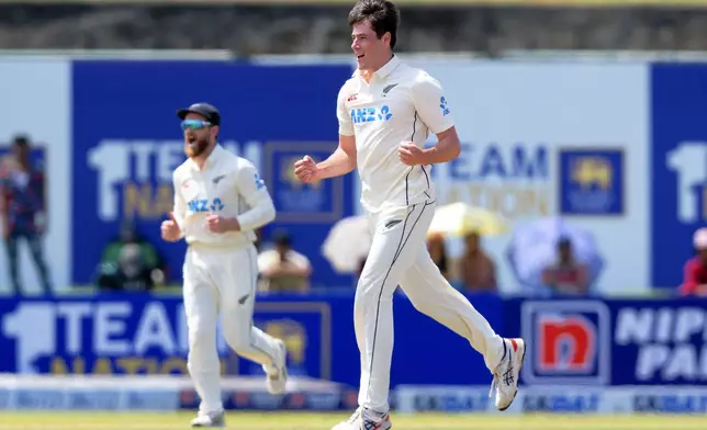 New Zealand's William O'Rourke, right, celebrates the wicket of Sri Lanka's Pathum Nissanka on the first day of the first cricket test match between New Zealand and Sri Lanka in Galle, Sri Lanka, Wednesday, Sept. 18, 2024. (AP Photo/Viraj Kothalawala)