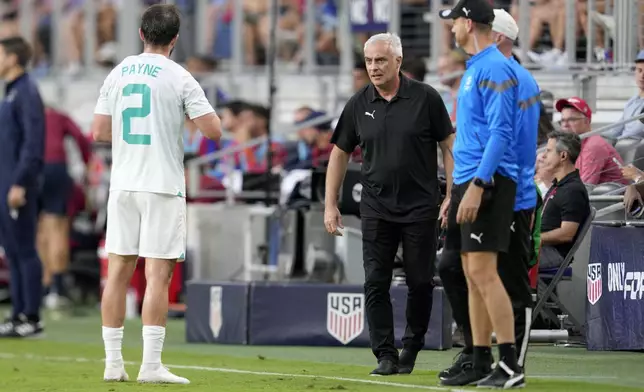 New Zealand head coach Darren Bazeley, center, speaks with Tim Payne (2) during the first half of a friendly soccer match against the United States, Tuesday, Sept. 10, 2024, in Cincinnati. (AP Photo/Jeff Dean)