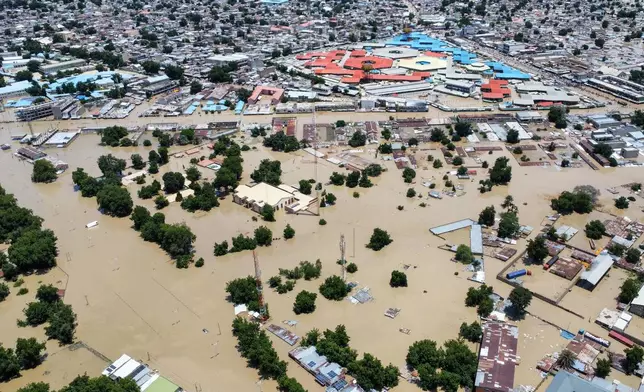 Houses are partially submerged following a dam collapse in Maiduguri, Nigeria, Tuesday, Sept 10, 2024. (AP Photos/ Musa Ajit Borno)