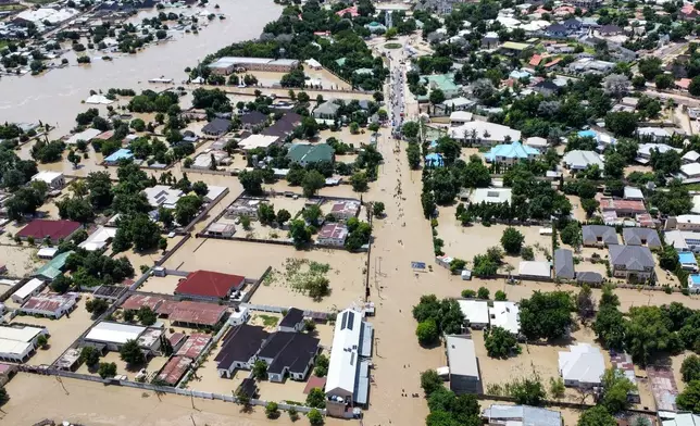 Houses are partially submerged following a dam collapse in Maiduguri, Nigeria, Tuesday, Sept 10, 2024. (AP Photos/ Musa Ajit Borno)