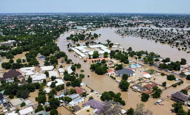 Houses are partially submerged following a dam collapse in Maiduguri, Nigeria, Tuesday, Sept 10, 2024. (AP Photos/ Musa Ajit Borno)