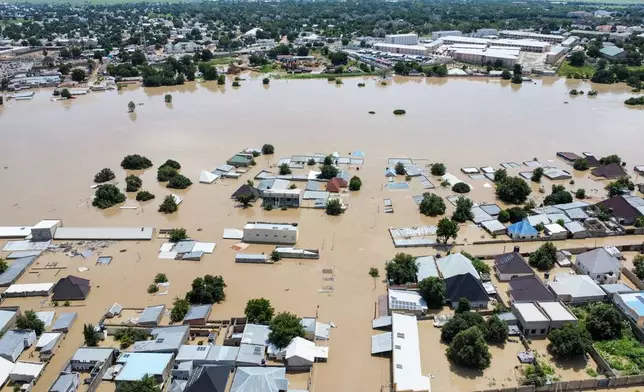 Houses are partially submerged following a dam collapse in Maiduguri, Nigeria, Tuesday, Sept 10, 2024. (AP Photos/ Musa Ajit Borno)