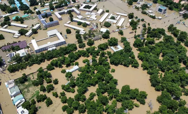 Houses are partially submerged following a dam collapse in Maiduguri, Nigeria, Tuesday, Sept 10, 2024. (AP Photos/ Musa Ajit Borno)