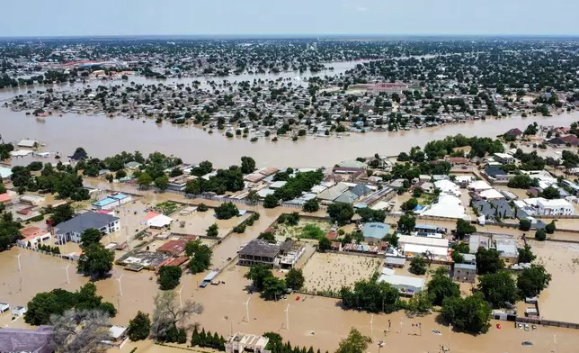 Houses are partially submerged following a dam collapse in Maiduguri, Nigeria, Tuesday, Sept 10, 2024. (AP Photos/ Musa Ajit Borno)