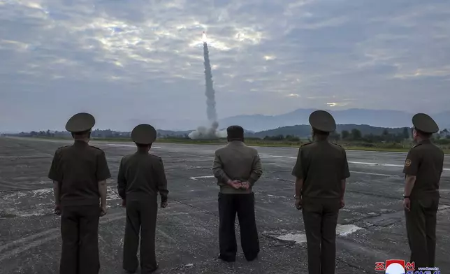 In this photo provided by the North Korean government, North Korean leader Kim Jong Un, center, oversees a launch of, what it says, the country’s newly built Hwasongpho-11-Da-4.5 ballistic missile at an undisclosed place in North Korea Wednesday, Sept. 18, 2024. Independent journalists were not given access to cover the event depicted in this image distributed by the North Korean government. The content of this image is as provided and cannot be independently verified. Korean language watermark on image as provided by source reads: "KCNA" which is the abbreviation for Korean Central News Agency. (Korean Central News Agency/Korea News Service via AP)