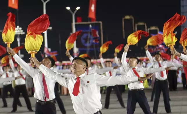 North Koreans perform during an evening gala as they celebrate the country's 76th founding anniversary at Kim Il Sung Square in Pyongyang, North Korea Sunday, Sept. 8, 2024. (AP Photo/Jon Chol Jin)