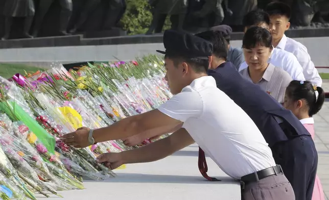 Pyongyang citizens pay respect to the statues of their late leaders Kim Il Sung and Kim Jong Il on Mansu Hill on the occasion of the country's 76th founding anniversary in Pyongyang, North Korea Monday, Sept. 9, 2024. (AP Photo/Jon Chol Jin)