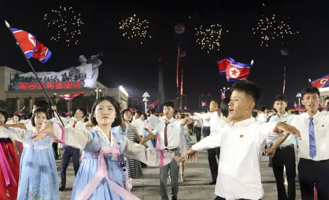 North Korean dance during an evening gala as they celebrate the country's 76th founding anniversary at Kim Il Sung Square in Pyongyang, North Korea Sunday, Sept. 8, 2024. (AP Photo/Cha Song Ho)