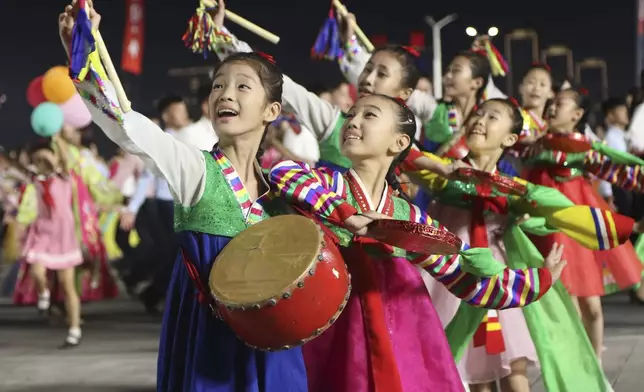 North Korean youth and students perform during an evening gala as they celebrate the country's 76th founding anniversary at Kim Il Sung Square in Pyongyang, North Korea Sunday, Sept. 8, 2024. (AP Photo/Jon Chol Jin)